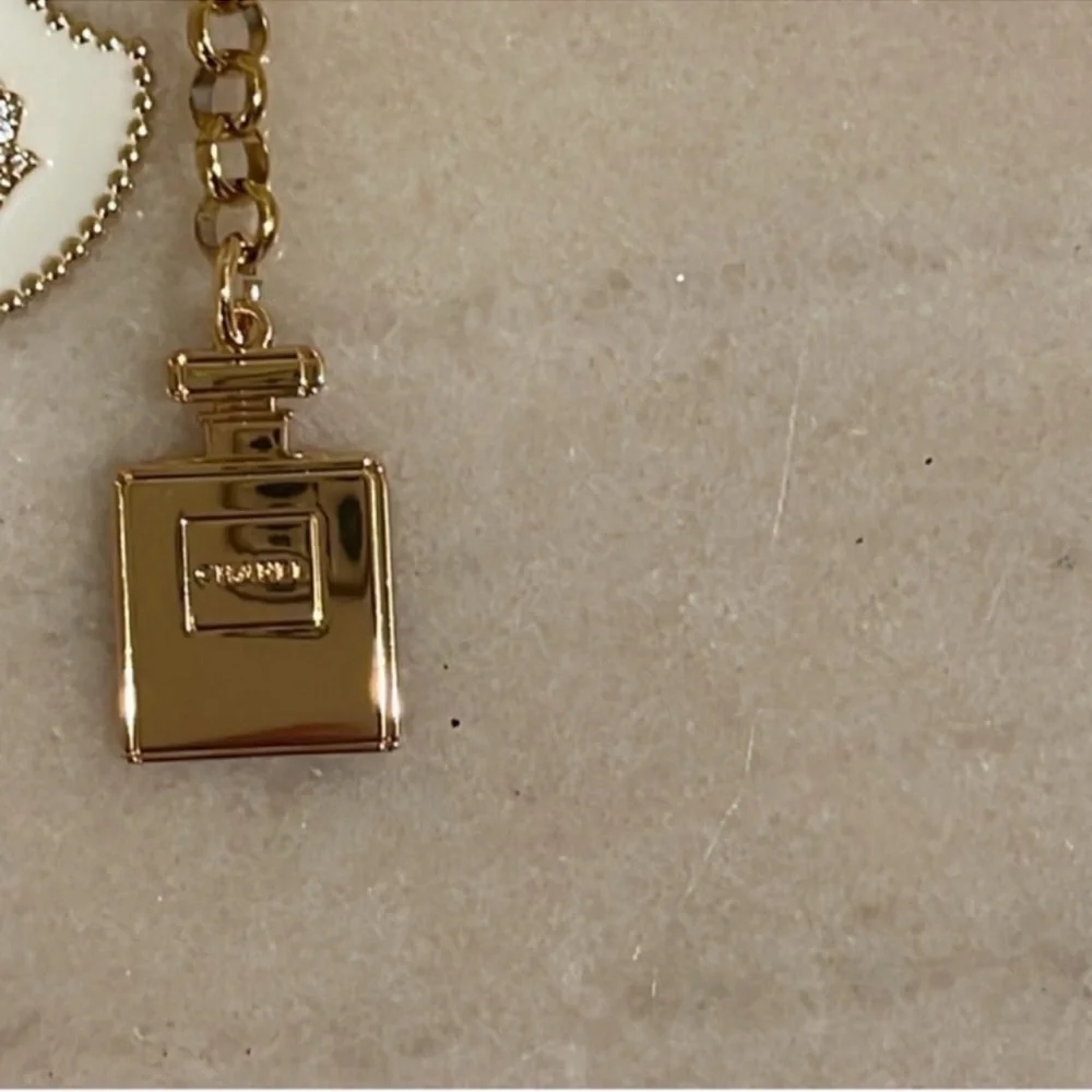 Chanel Holiday Fragrance Charm With Gold and Pearl Necklace